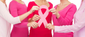 Close up of women with cancer awareness ribbons